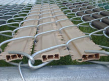 Wing Slat - This slat is self-locking. The entire slat is wider than most providing very good privacy. The picture on the left shows a top view looking down at the Wing Privacy Fence Slat.